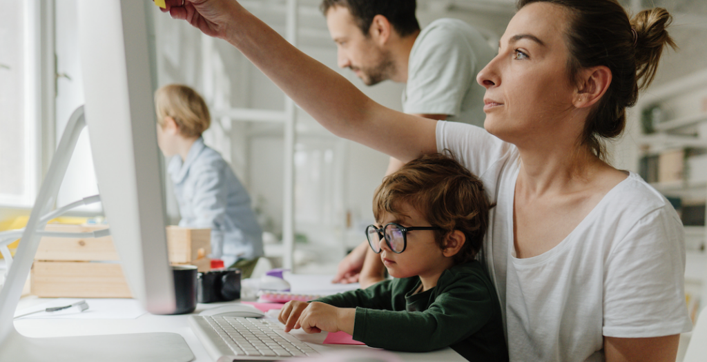 parents working from home with a young family
